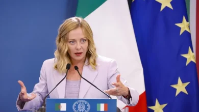 Time magazine features Italian Prime Minister Giorgia Meloni on its cover, calling her leadership style potentially world-changing. The article explores her rise to power, surprising critics with pragmatic policies and alliances despite her party's right-wing origins.