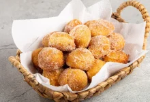 Aprenda a fazer um delicioso bolinho de chuva fofinho sem leite e sem farinha de trigo. Uma receita prática, leve e perfeita para o lanche da tarde.